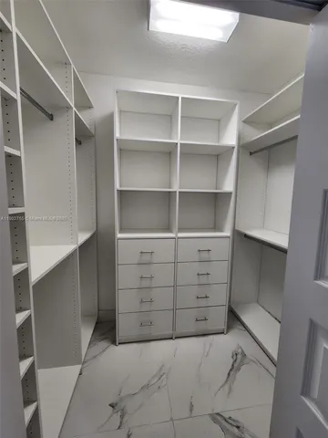 a view of an empty walk in closet