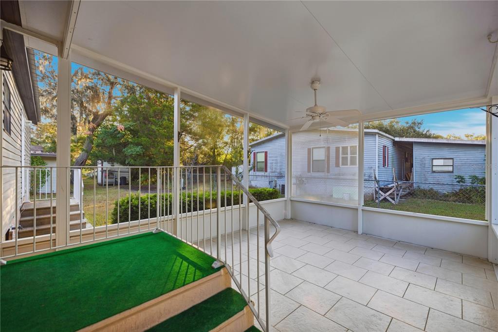6524 Southeast 110th Lane Belleview, FL 34420 - Photo 23 of 32 a view of a house with a backyard and a patio