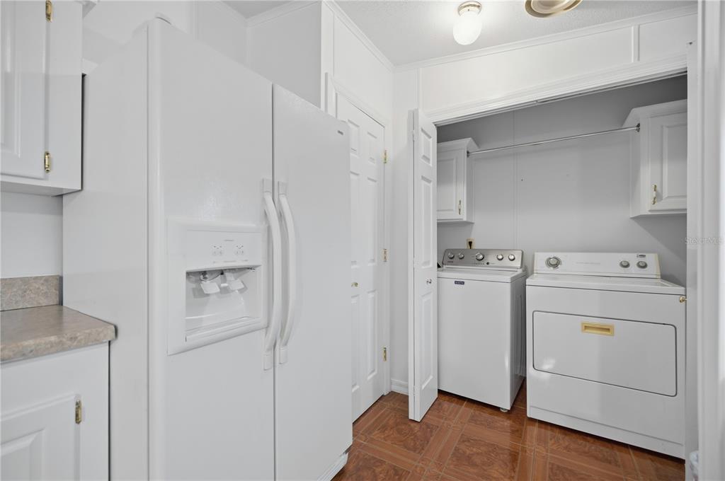 6524 Southeast 110th Lane Belleview, FL 34420 - Photo 10 of 32 a view of a storage & utility room with a washer dryer