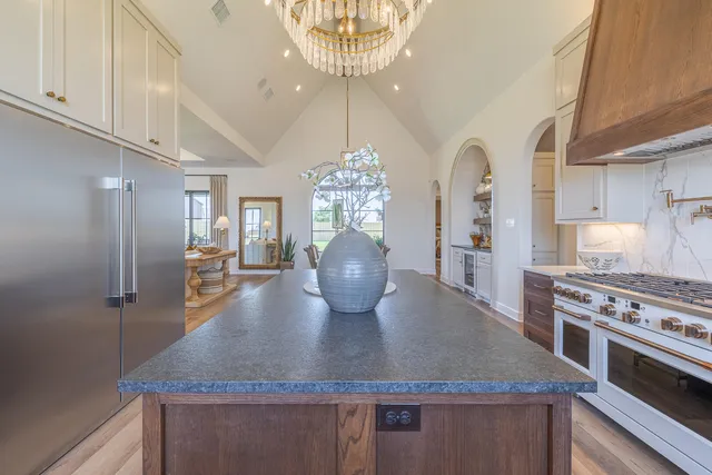 a kitchen with a sink cabinets and window