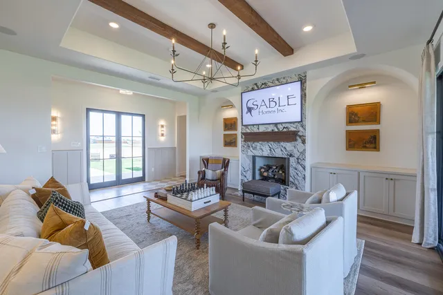 a kitchen with stainless steel appliances granite countertop a stove and a white cabinets
