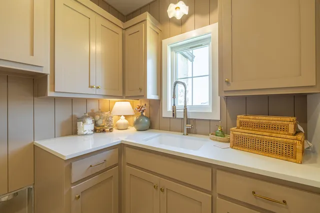 a spacious bathroom with a granite countertop sink a mirror and a