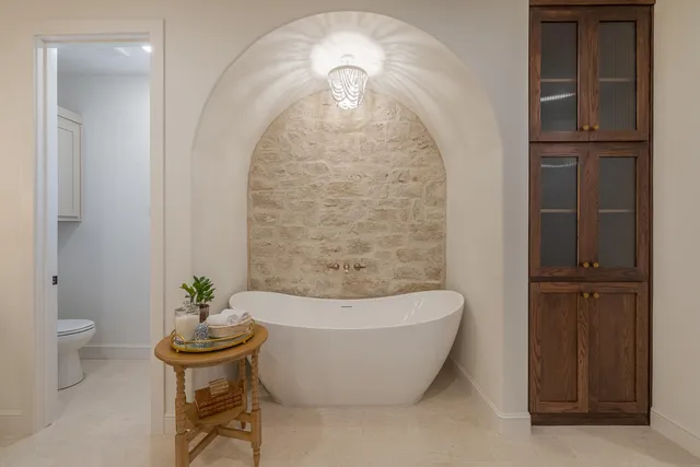 a view of living room with patio furniture and a potted plant