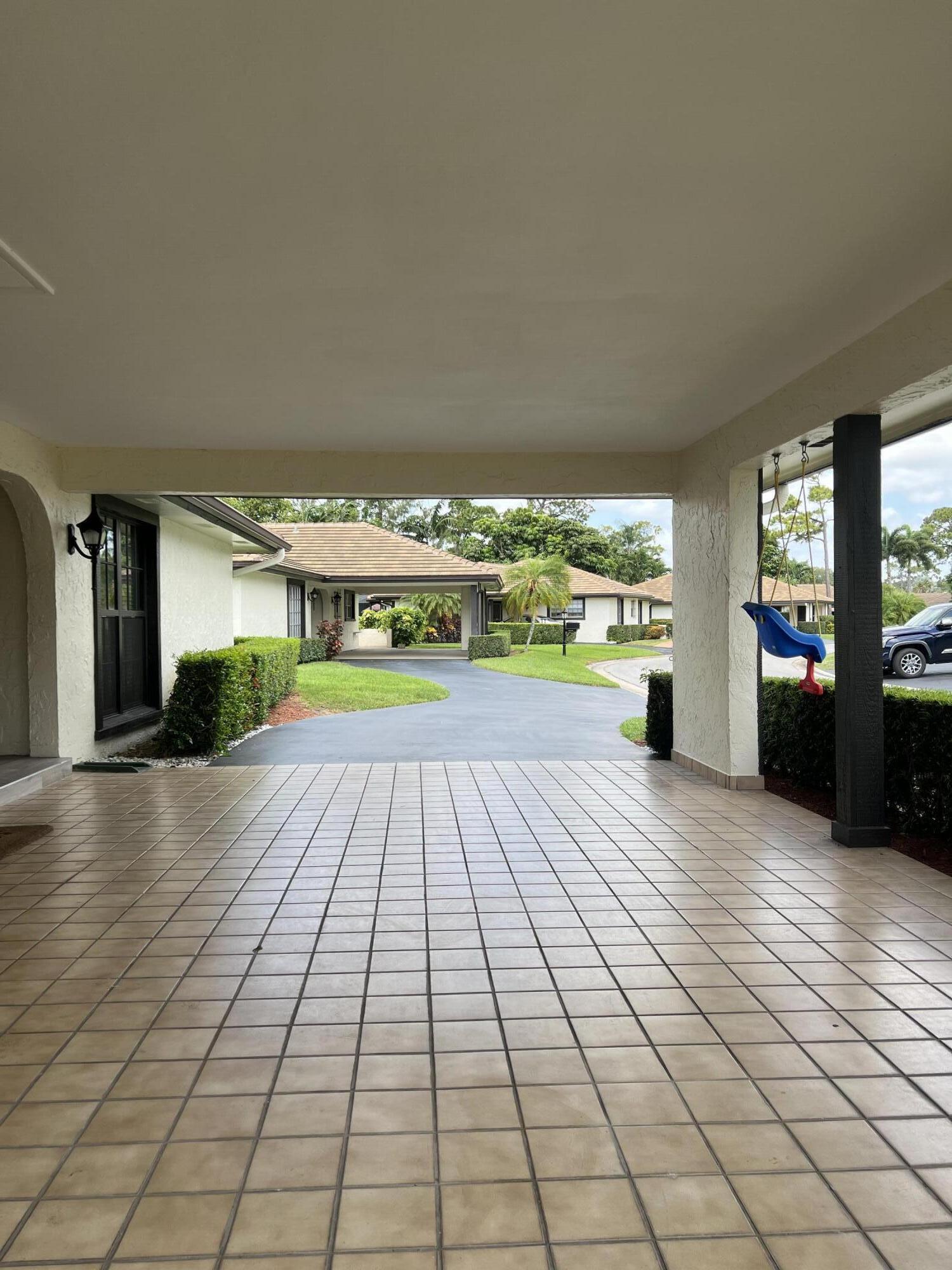 442 Pine Villa Drive Atlantis, FL 33462 - Photo 21 of 25 Large carport