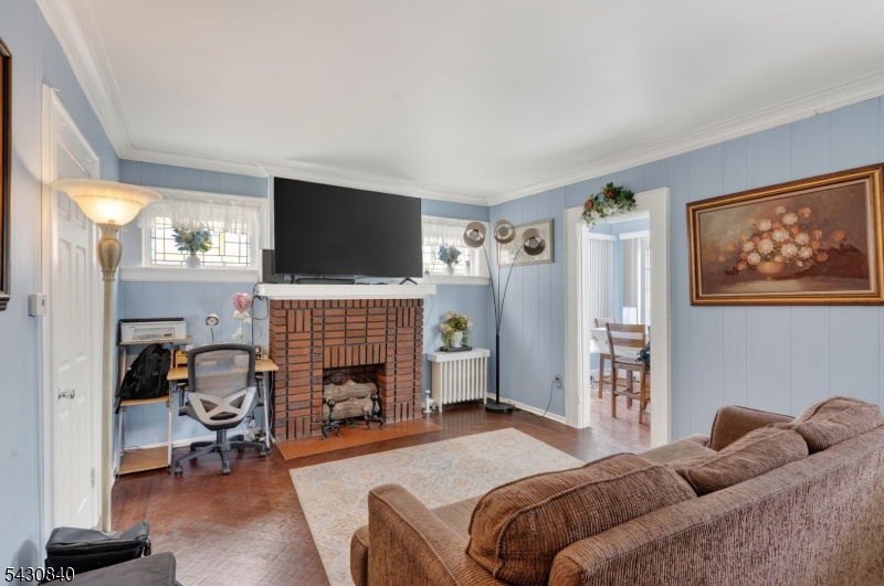 1629 May Street Union, NJ 07083 - Photo 1 of 13 a bedroom with a bed and a flat screen tv