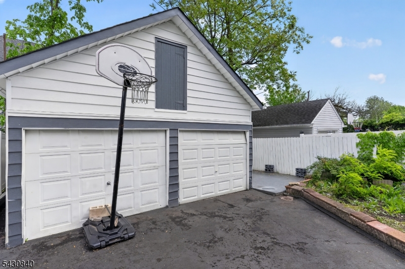 1629 May Street Union, NJ 07083 - Photo 13 of 13 a view of a house with a garage