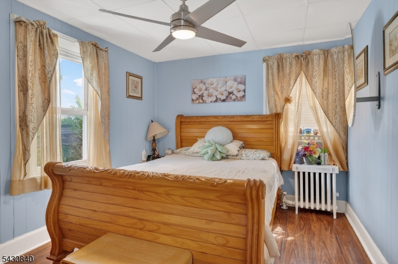 1629 May Street Union, NJ 07083 - Photo 6 of 13 a bedroom with a bed and wooden floor