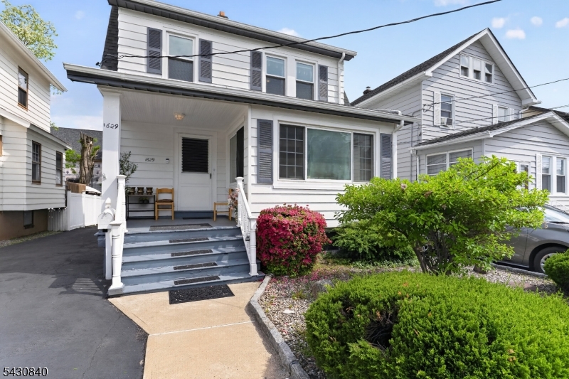 1629 May Street Union, NJ 07083 - Photo 10 of 13 a front view of a house with a garden