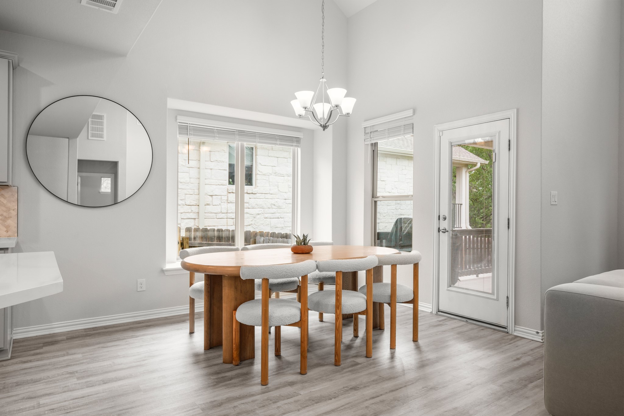 6708 Avila Way Pflugerville, TX 78660 - Photo 14 of 36 a view of a dining room with furniture window and wooden floor