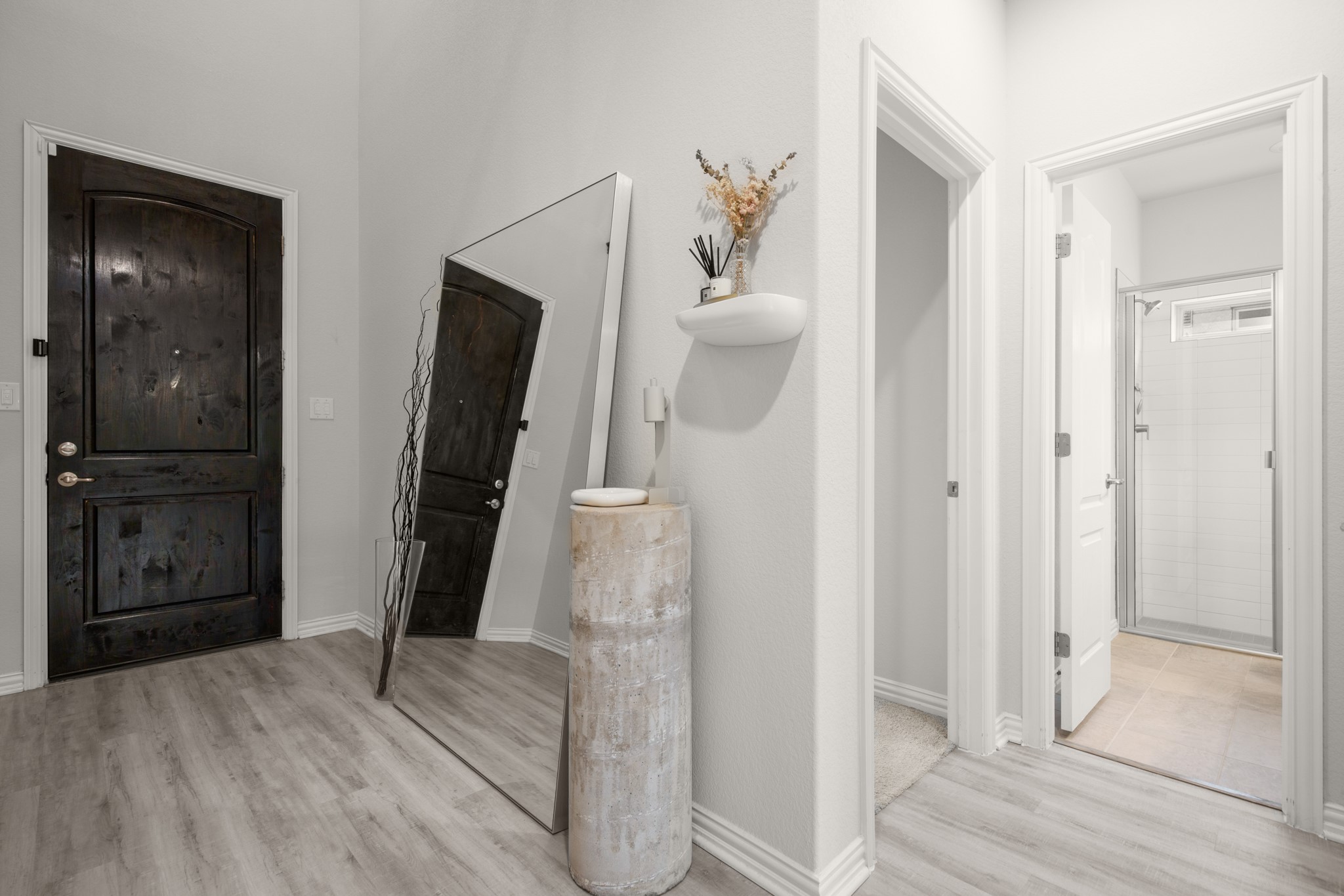 6708 Avila Way Pflugerville, TX 78660 - Photo 20 of 36 a view of hallway with bathroom and wooden floor