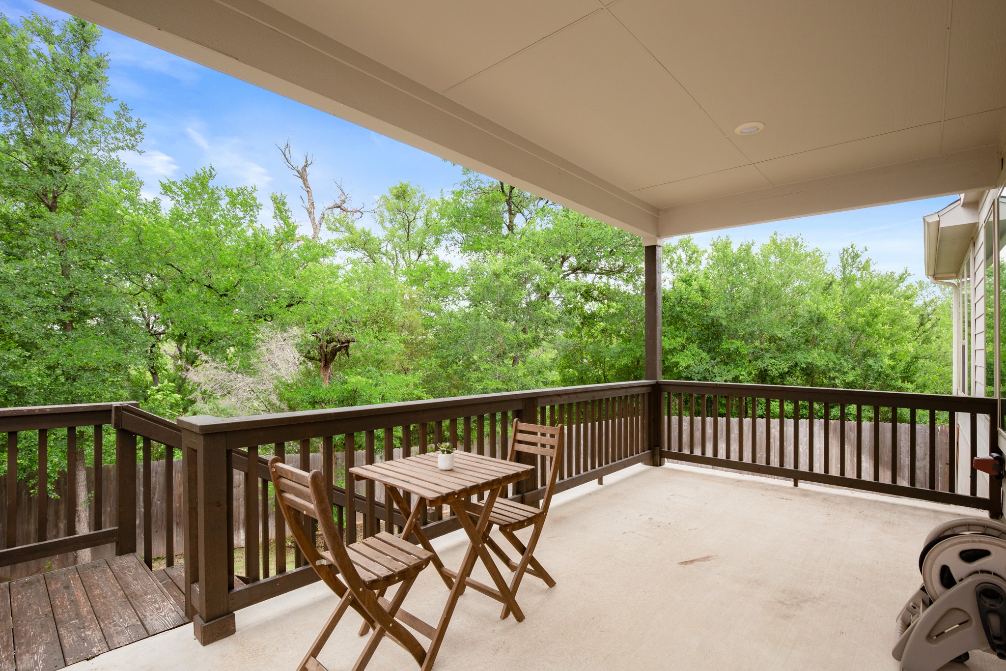 6708 Avila Way Pflugerville, TX 78660 - Photo 2 of 36 a view of a balcony with chairs and wooden fence