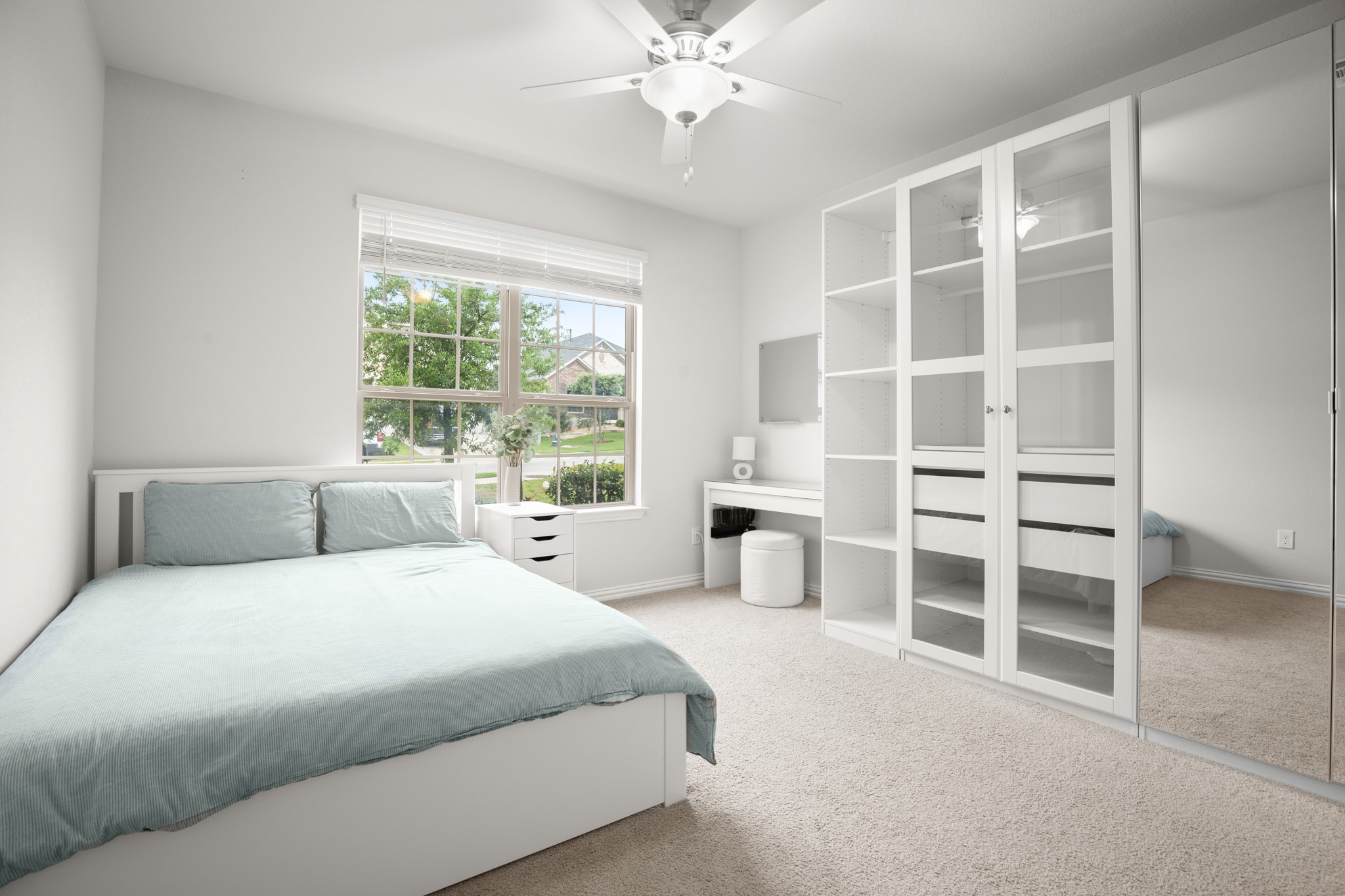 6708 Avila Way Pflugerville, TX 78660 - Photo 21 of 36 a bedroom with a large bed and a window