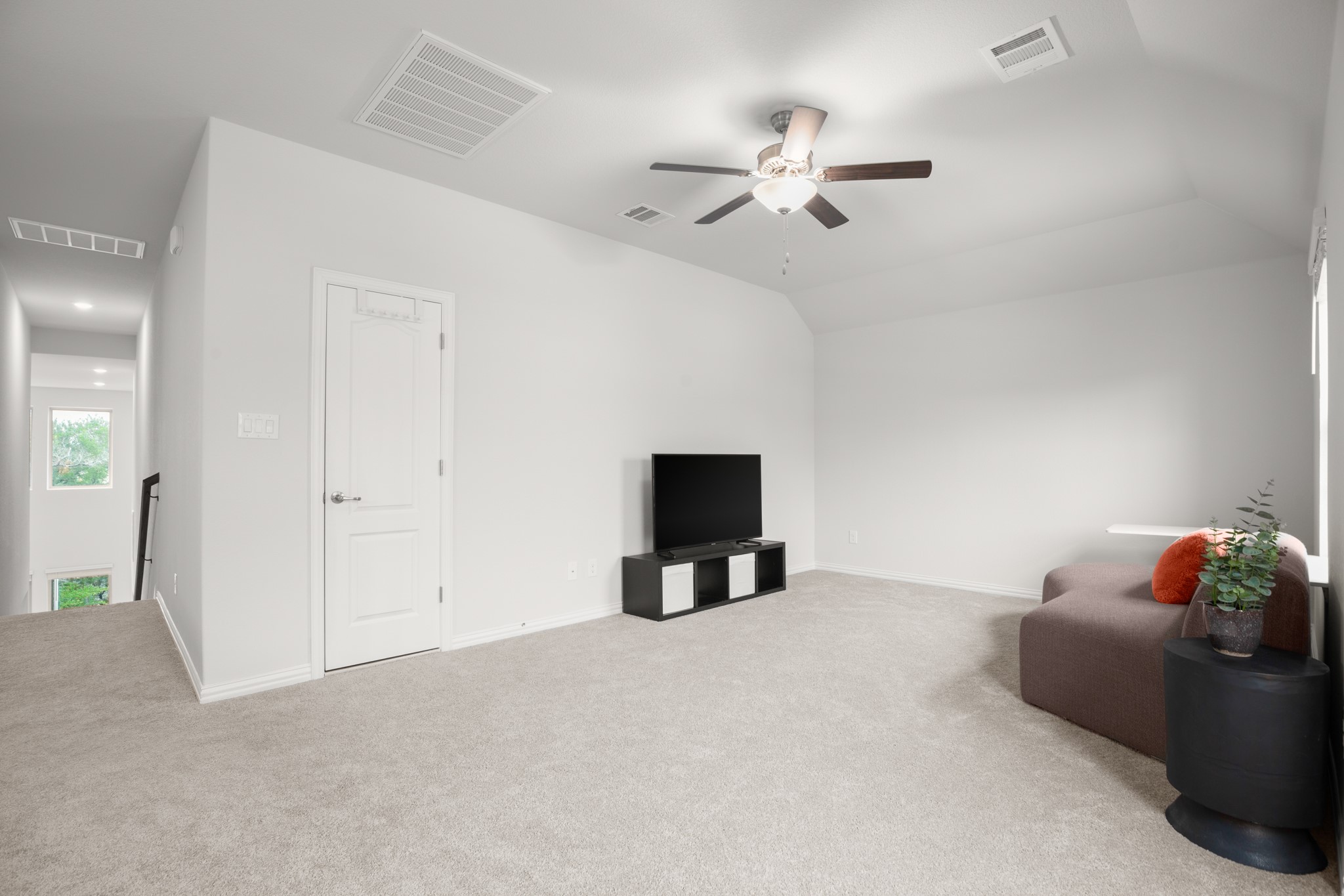 6708 Avila Way Pflugerville, TX 78660 - Photo 24 of 36 a living room with furniture and a flat screen tv