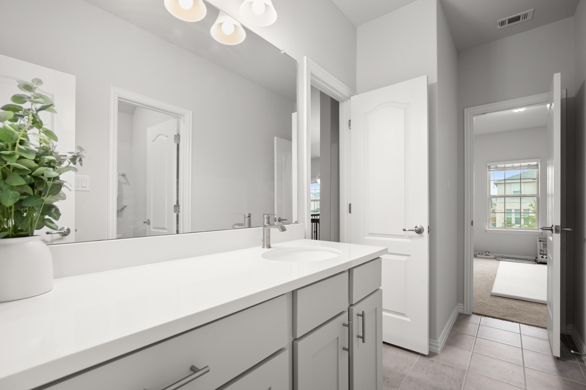 6708 Avila Way Pflugerville, TX 78660 - Photo 29 of 36 a bathroom with a sink and a mirror