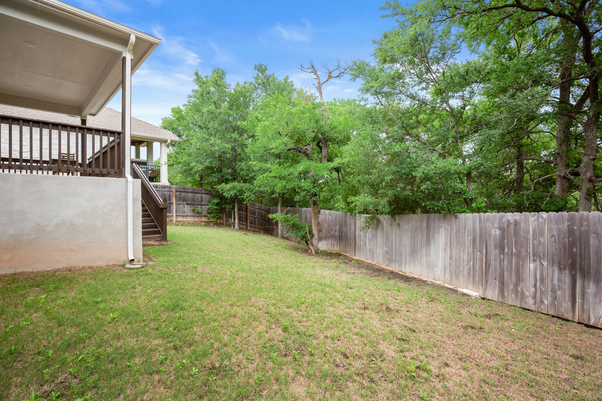 6708 Avila Way Pflugerville, TX 78660 - Photo 33 of 36 a backyard of a house with lots of green space