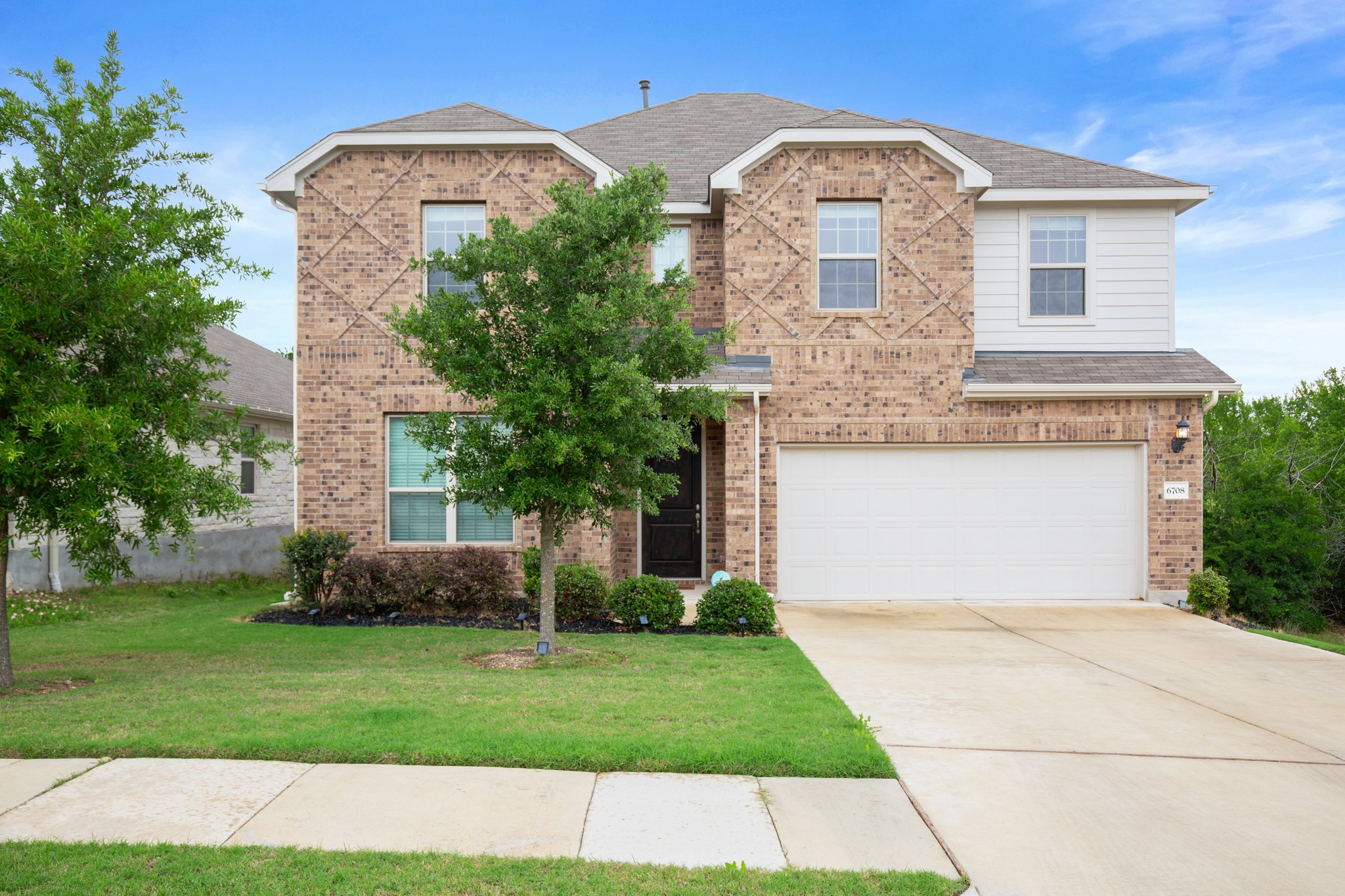 6708 Avila Way Pflugerville, TX 78660 - Photo 36 of 36 a front view of a house with a garden
