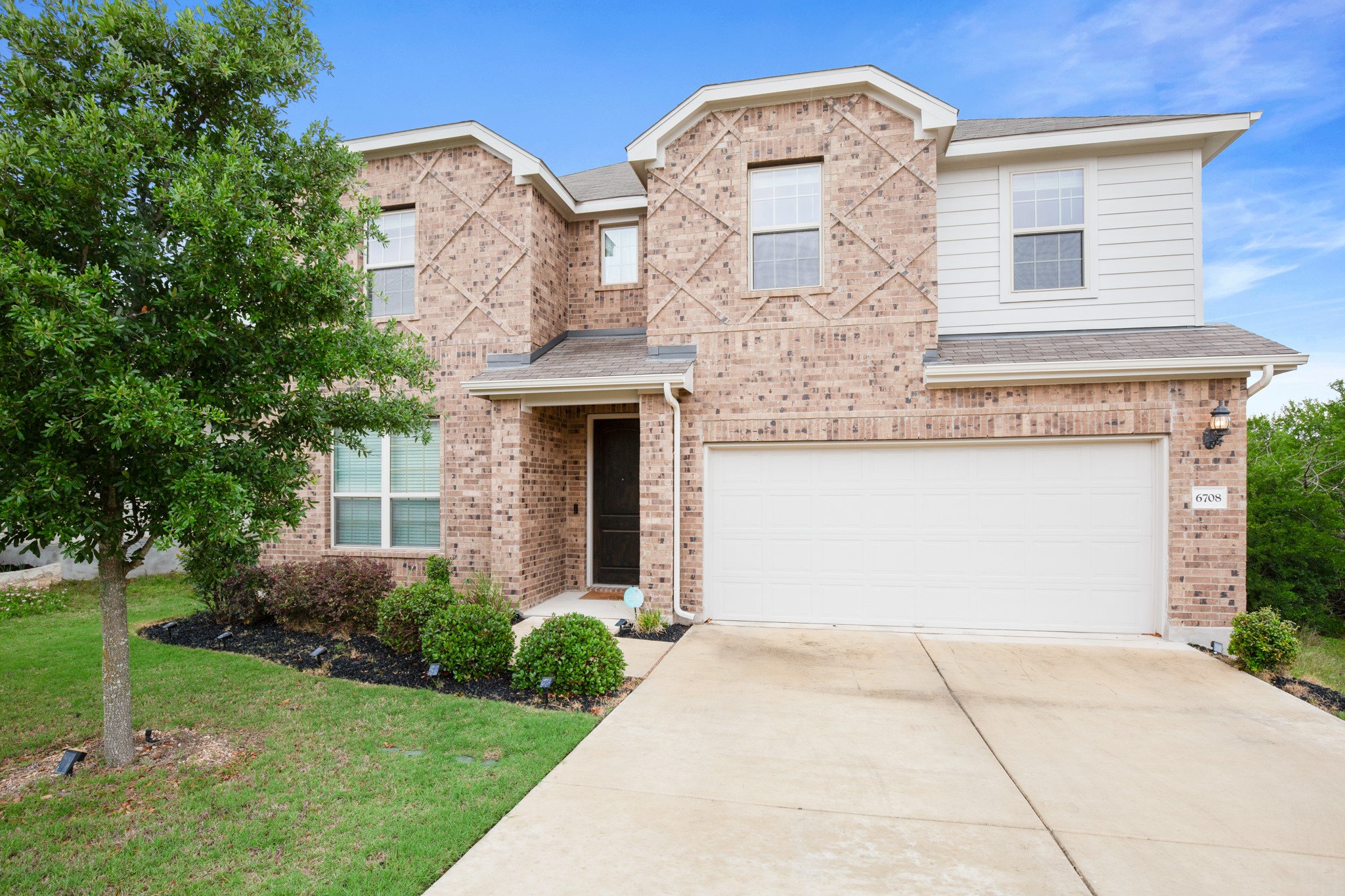6708 Avila Way Pflugerville, TX 78660 - Photo 7 of 36 a front view of a house with garden