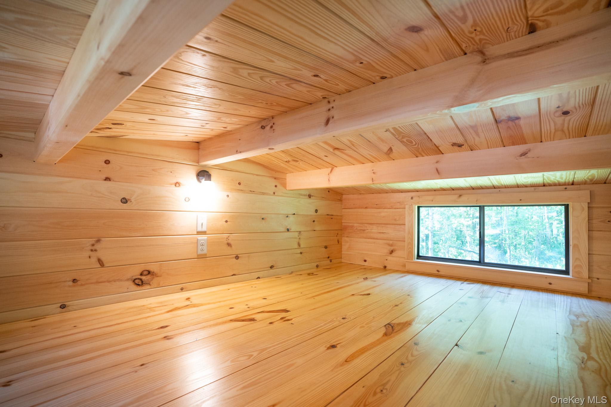 2155 Ed Klug Road Franklin, NY 13839 - Photo 14 of 24 a view of empty room with wooden floor and fan