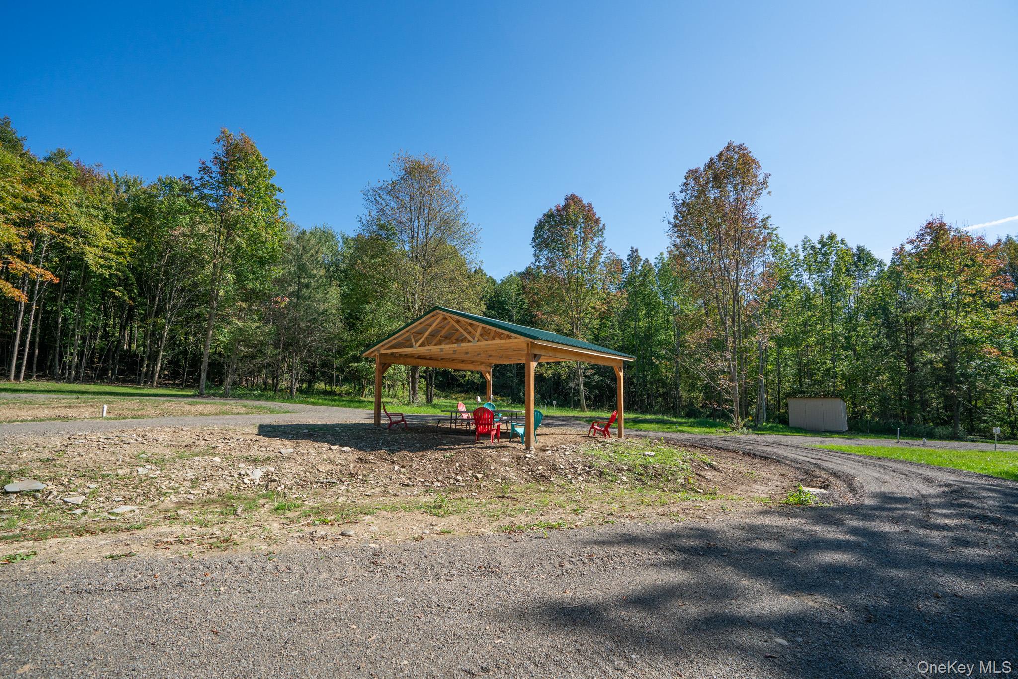 2155 Ed Klug Road Franklin, NY 13839 - Photo 18 of 24 a view of a table and chairs under an umbrella