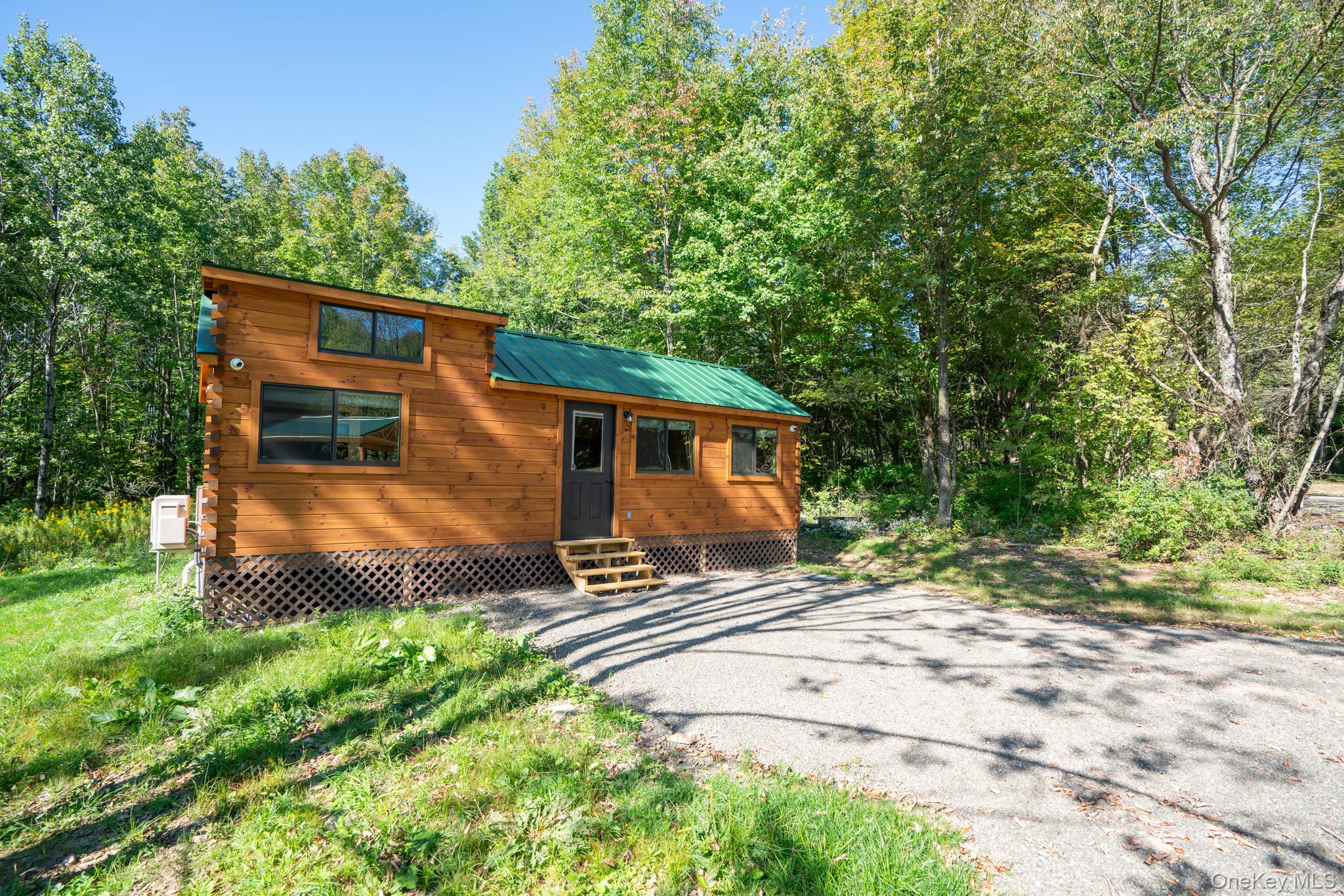 2155 Ed Klug Road Franklin, NY 13839 - Photo 2 of 24 a front view of a house with a yard