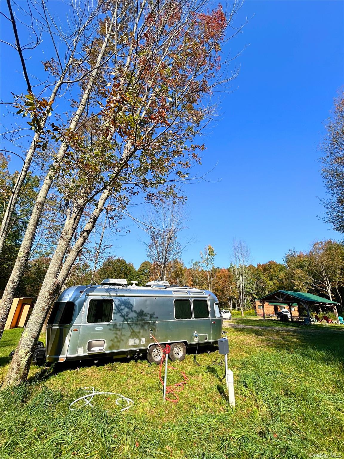 2155 Ed Klug Road Franklin, NY 13839 - Photo 23 of 24 a backyard of a house with table and chairs
