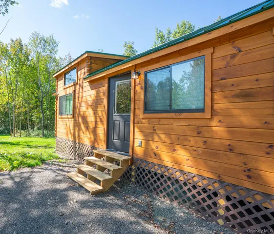 a blue bench sitting in front of a house