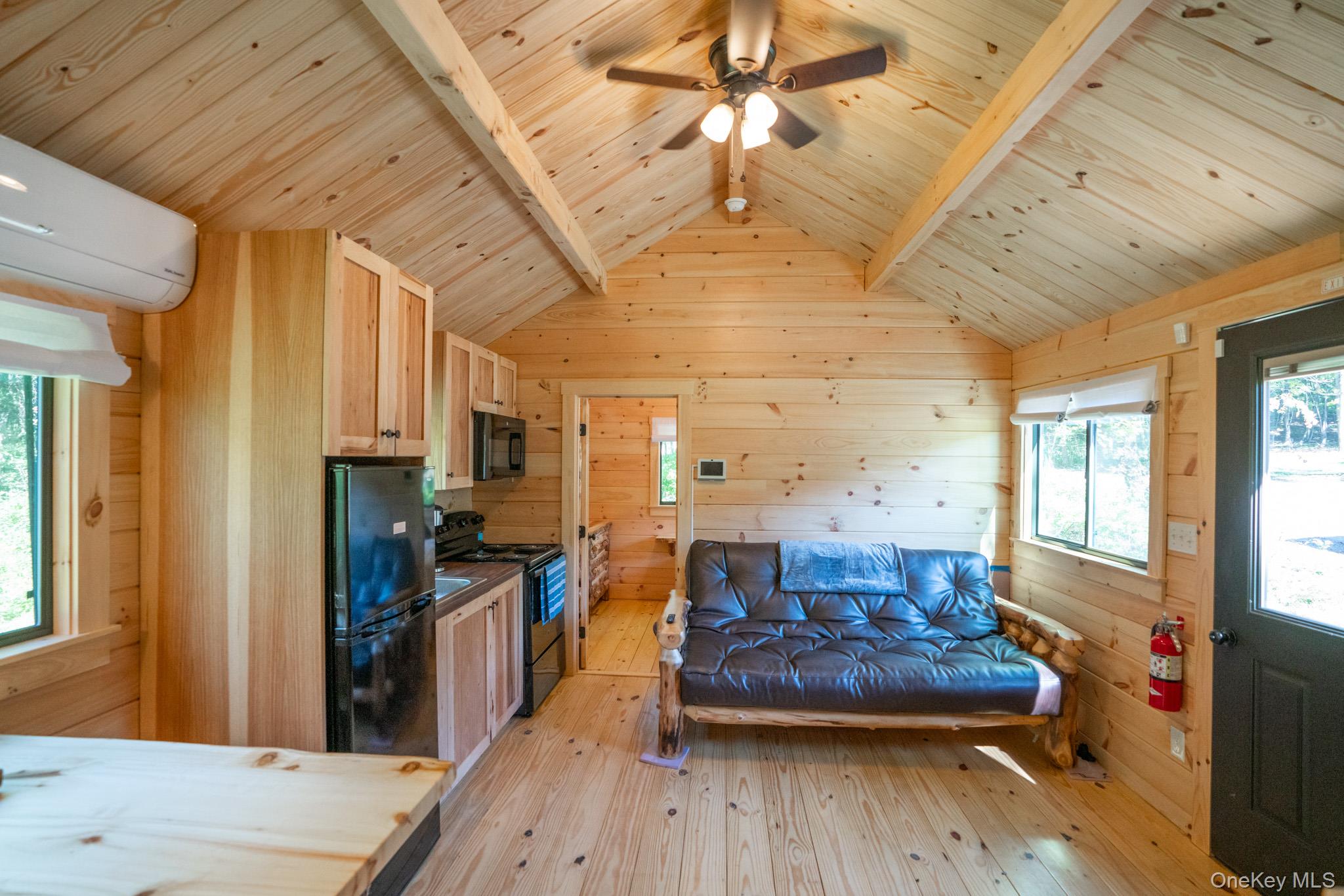 2155 Ed Klug Road Franklin, NY 13839 - Photo 7 of 24 a living room with furniture and a wooden floor