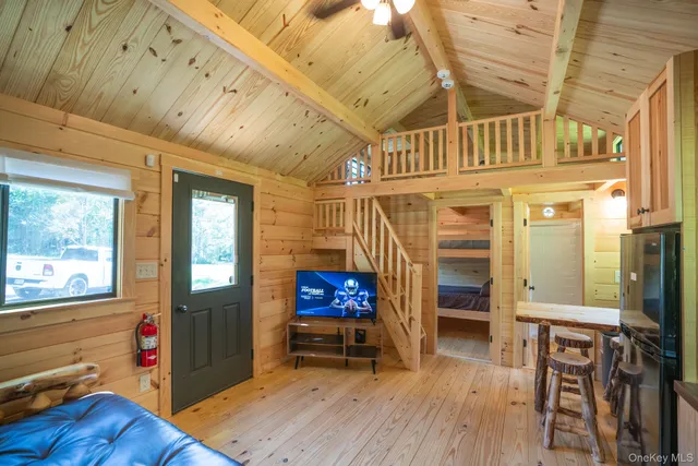 a view of an entryway with wooden floor and windows