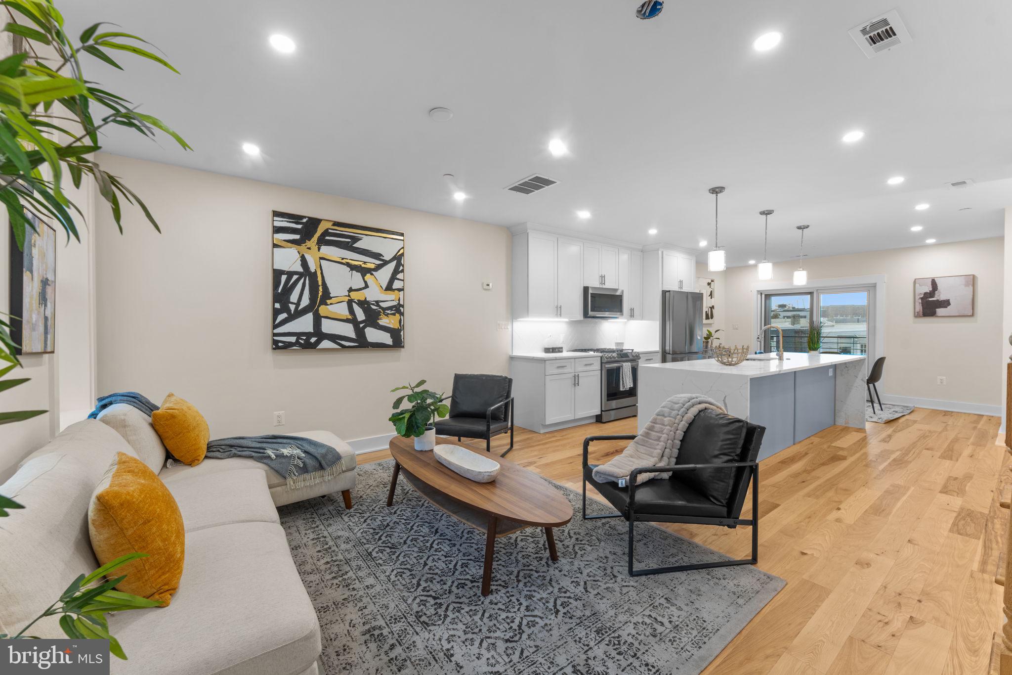 521 Florida Avenue Northeast, Unit 2 Washington, DC 20002 - Photo 13 of 38 a living room with furniture and a potted plant