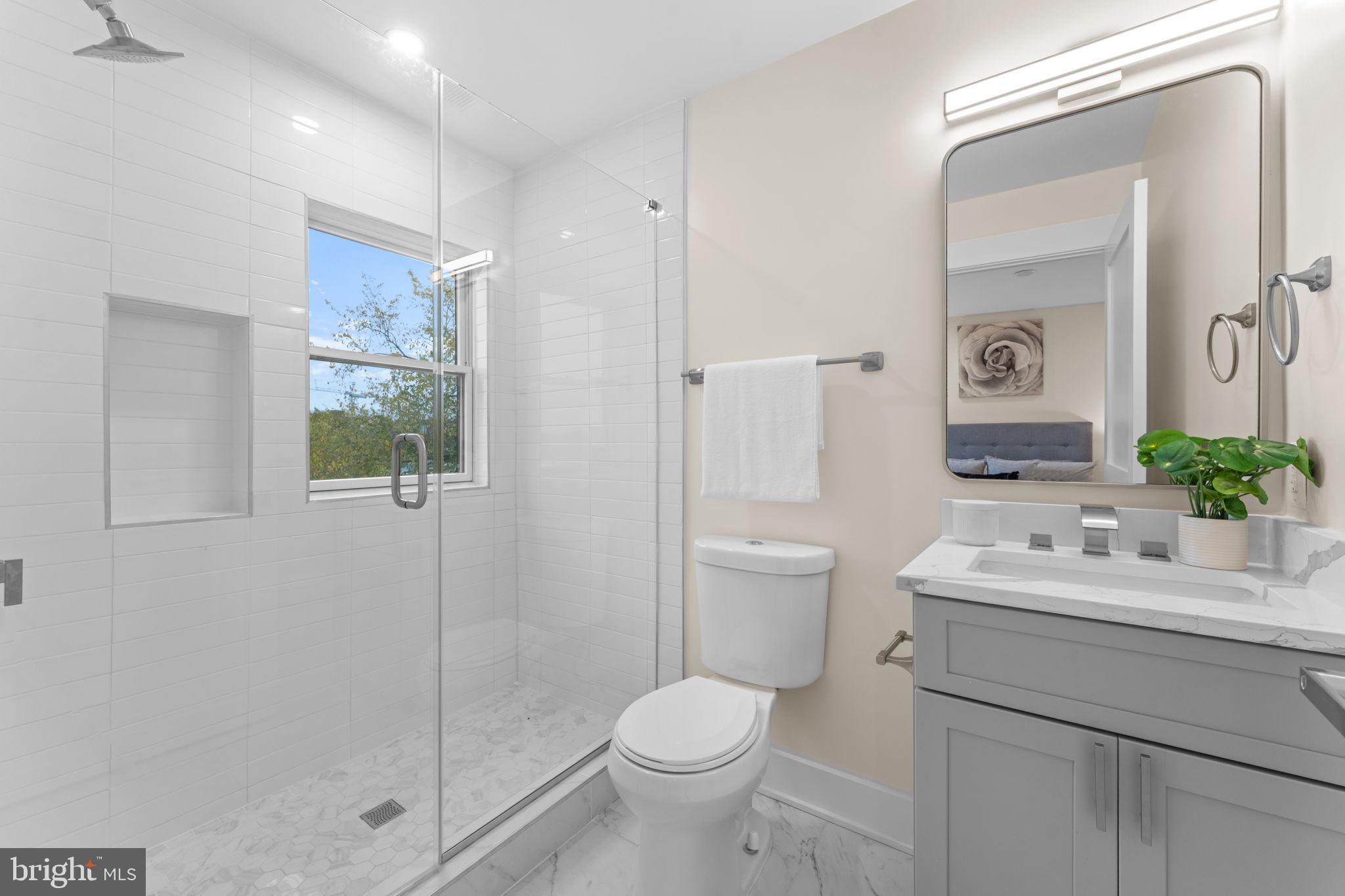 521 Florida Avenue Northeast, Unit 2 Washington, DC 20002 - Photo 20 of 38 a bathroom with a toilet sink and shower