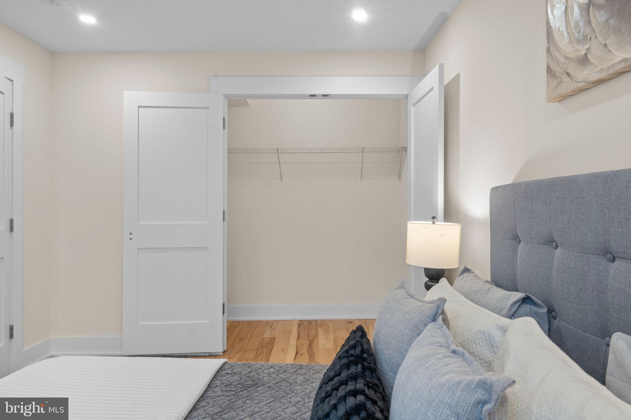 521 Florida Avenue Northeast, Unit 2 Washington, DC 20002 - Photo 21 of 38 a bedroom with a bed and mirror