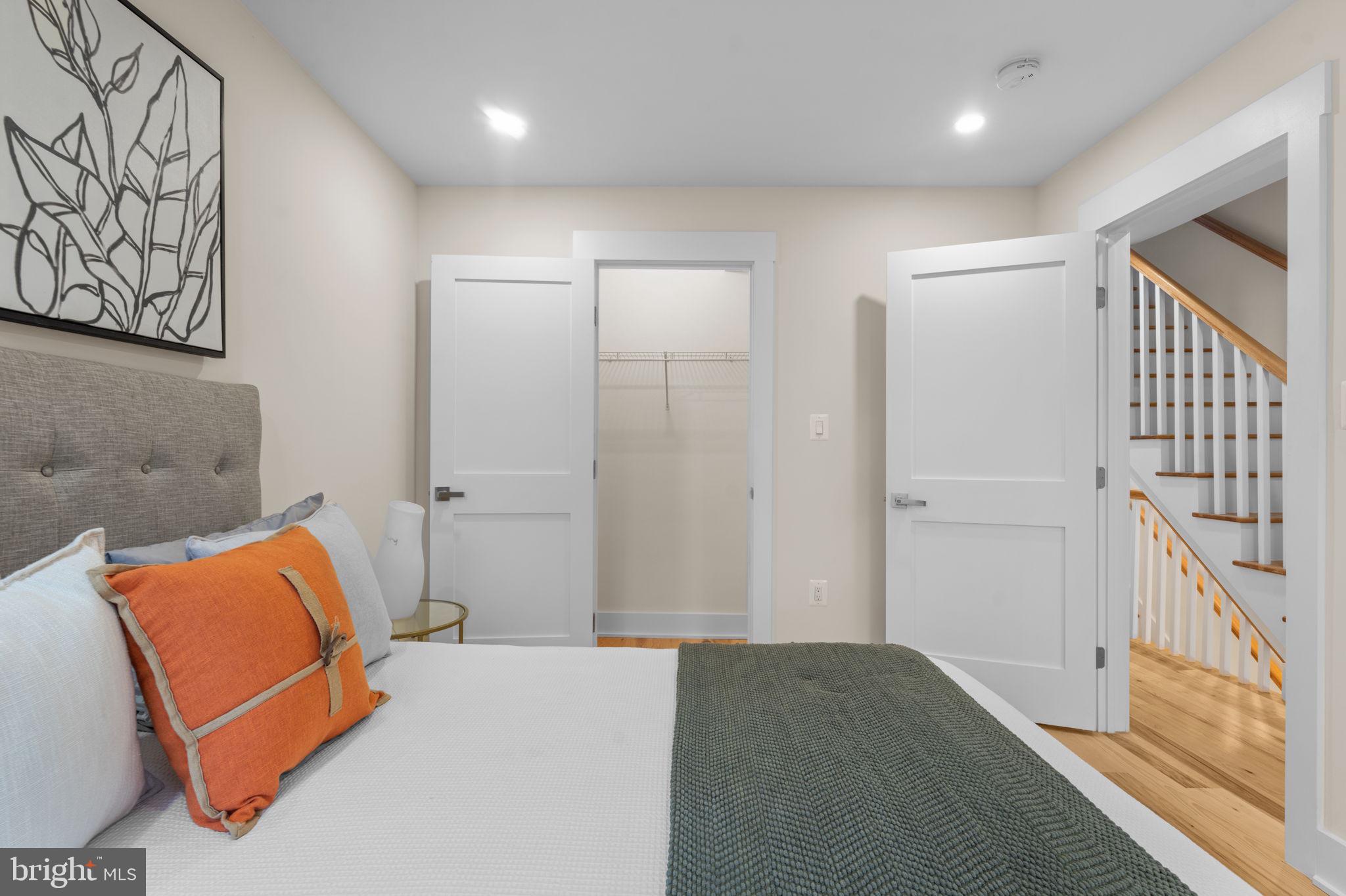 521 Florida Avenue Northeast, Unit 2 Washington, DC 20002 - Photo 26 of 38 a bedroom with a bed and a couch