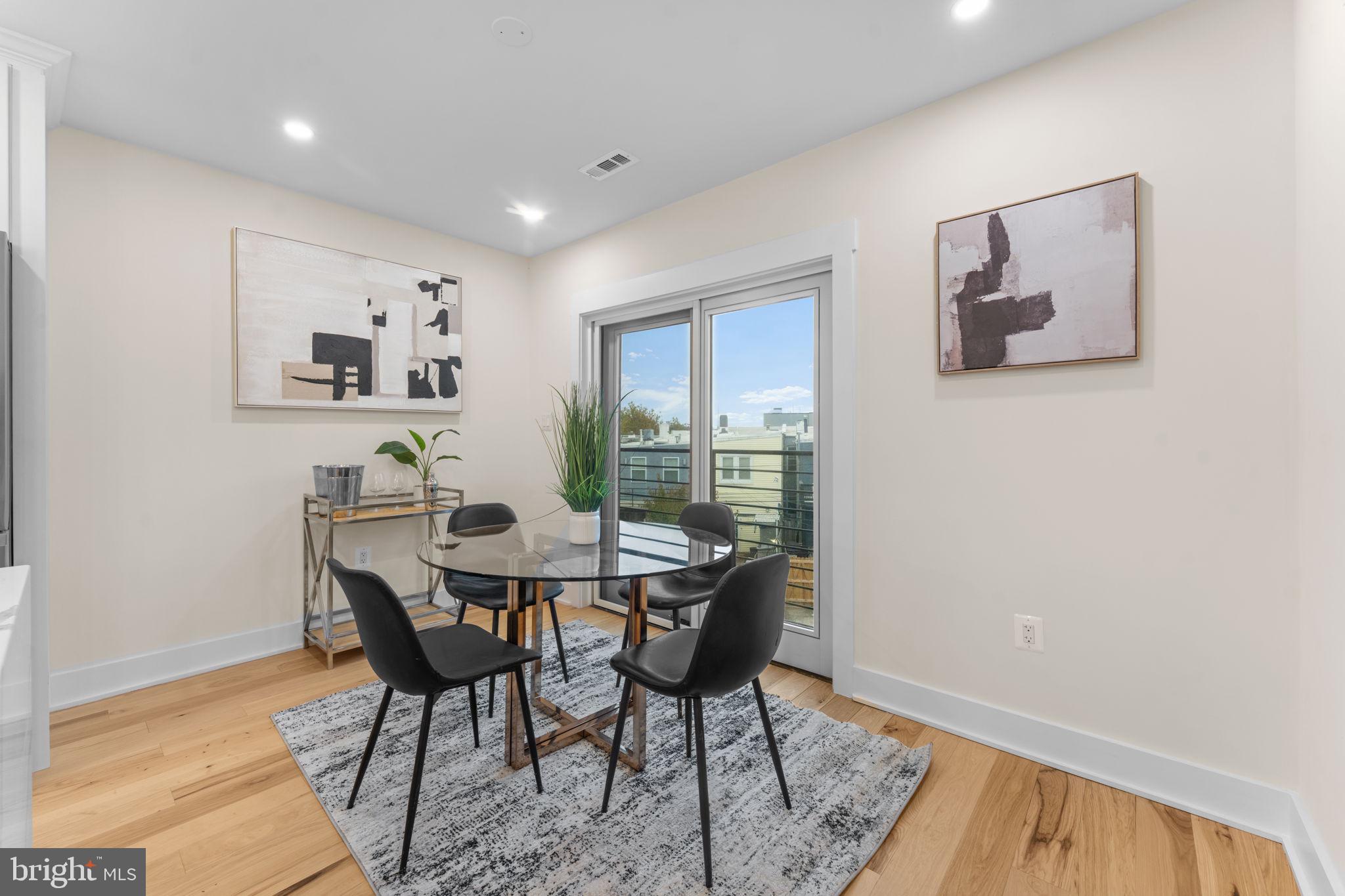 521 Florida Avenue Northeast, Unit 2 Washington, DC 20002 - Photo 7 of 38 a view of a dining room with furniture and wooden floor