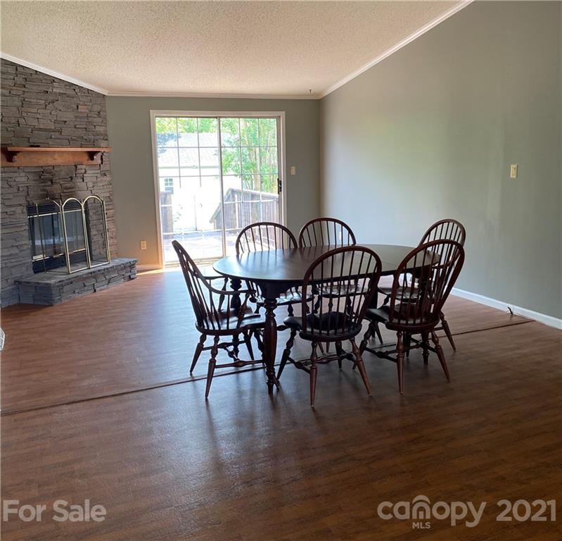 525 Goodwin Road Salisbury, NC 28146 - Photo 11 of 46 a view of a dining room with furniture window and wooden floor