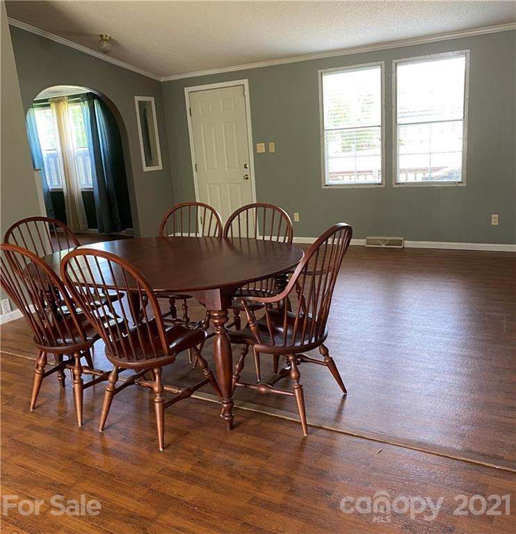 525 Goodwin Road Salisbury, NC 28146 - Photo 13 of 46 a view of a dining room with furniture and wooden floor