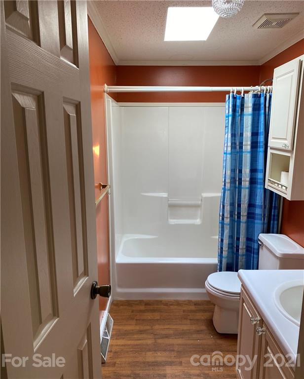 525 Goodwin Road Salisbury, NC 28146 - Photo 29 of 46 a bathroom with a toilet and a shower