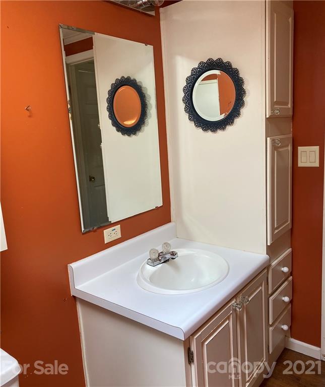 525 Goodwin Road Salisbury, NC 28146 - Photo 31 of 46 a bathroom with a sink and a mirror