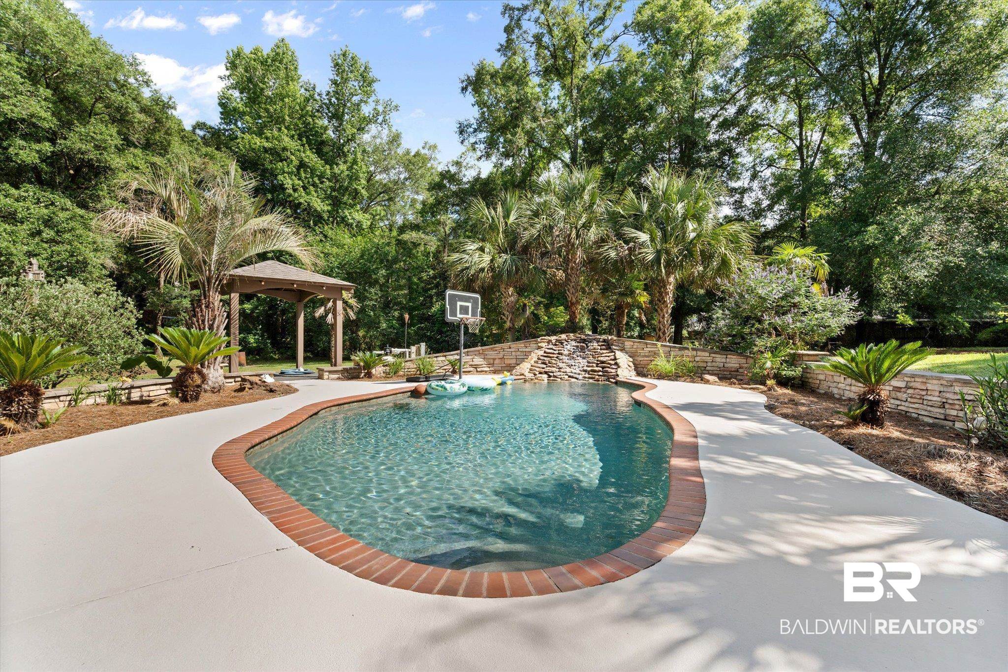 3715 Latigo Road Mobile, AL 36695 - Photo 25 of 39 View of swimming pool featuring a gazebo and view of scattered trees