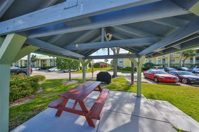 a view of a backyard with sitting area