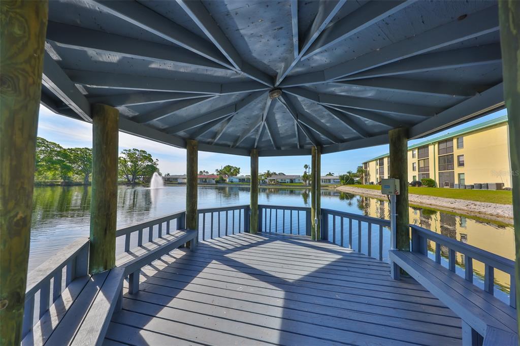 6123 113th Street, Unit 510 Seminole, FL 33772 - Photo 28 of 44 a view of a balcony with wooden floor