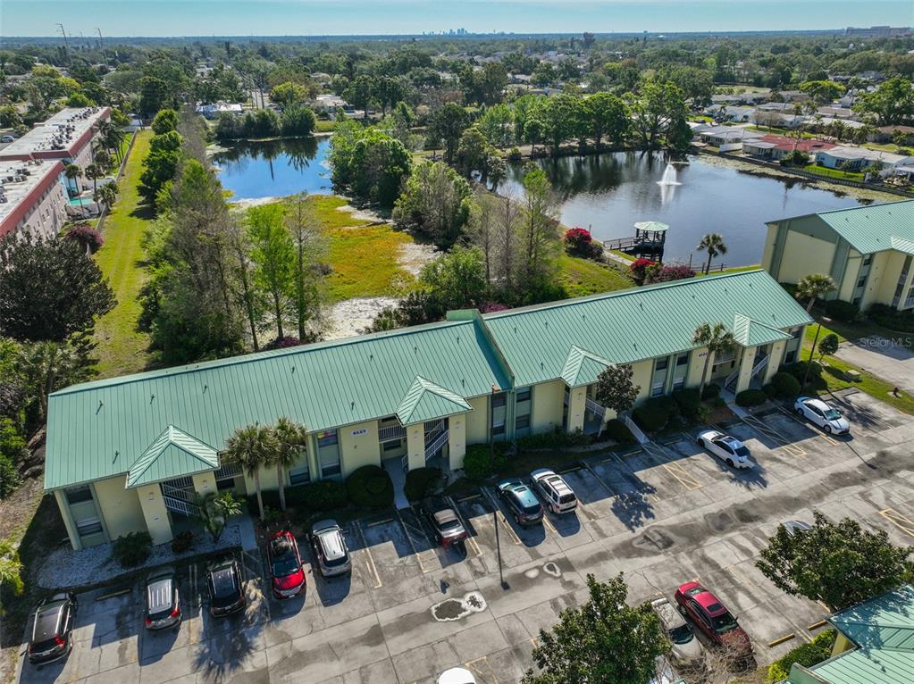 6123 113th Street, Unit 510 Seminole, FL 33772 - Photo 29 of 44 an aerial view of a house with outdoor space and lake view