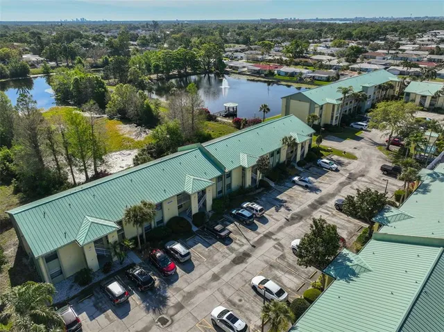 an aerial view of a house with a lake view
