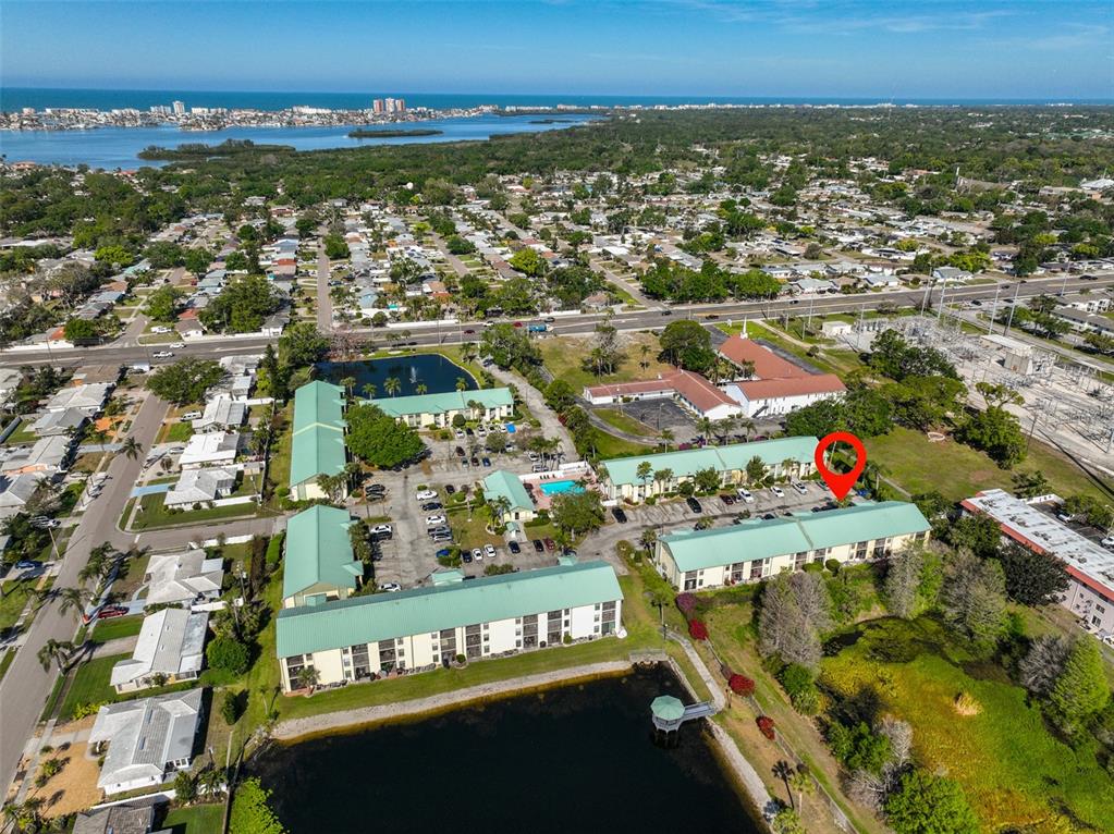 6123 113th Street, Unit 510 Seminole, FL 33772 - Photo 35 of 44 an aerial view of residential building and car parked on street side