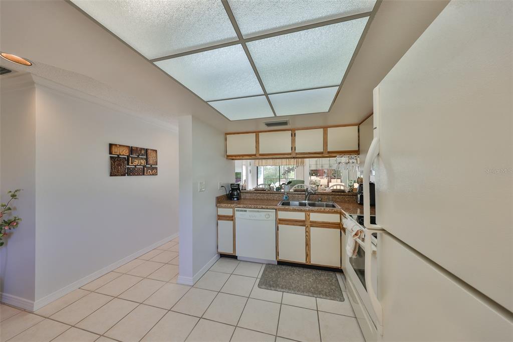 6123 113th Street, Unit 510 Seminole, FL 33772 - Photo 4 of 44 a kitchen with a stove and a sink