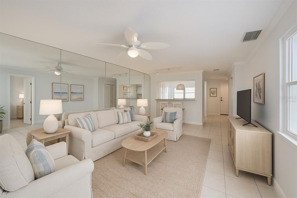 6123 113th Street, Unit 510 Seminole, FL 33772 - Photo 44 of 44 a living room with furniture and a flat screen tv