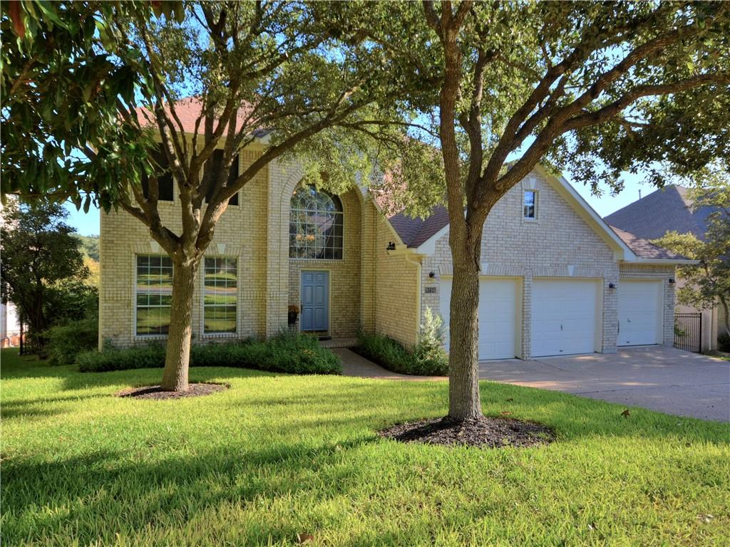 9216 Evening Primrose Path Austin, TX 78750 - Photo 1 of 30 a front view of house with yard and green space
