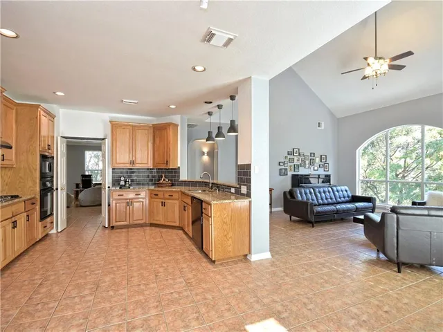 a view of a backyard with plants and trees
