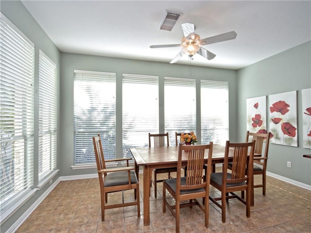 9216 Evening Primrose Path Austin, TX 78750 - Photo 14 of 31 a view of a dining room with furniture window and outside view