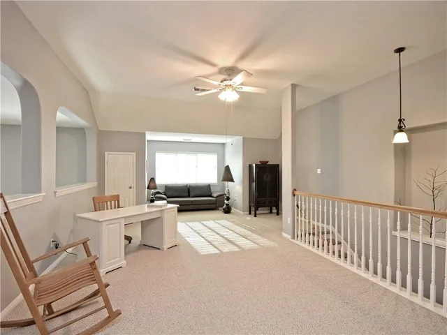 a utility room with cabinets washer and dryer