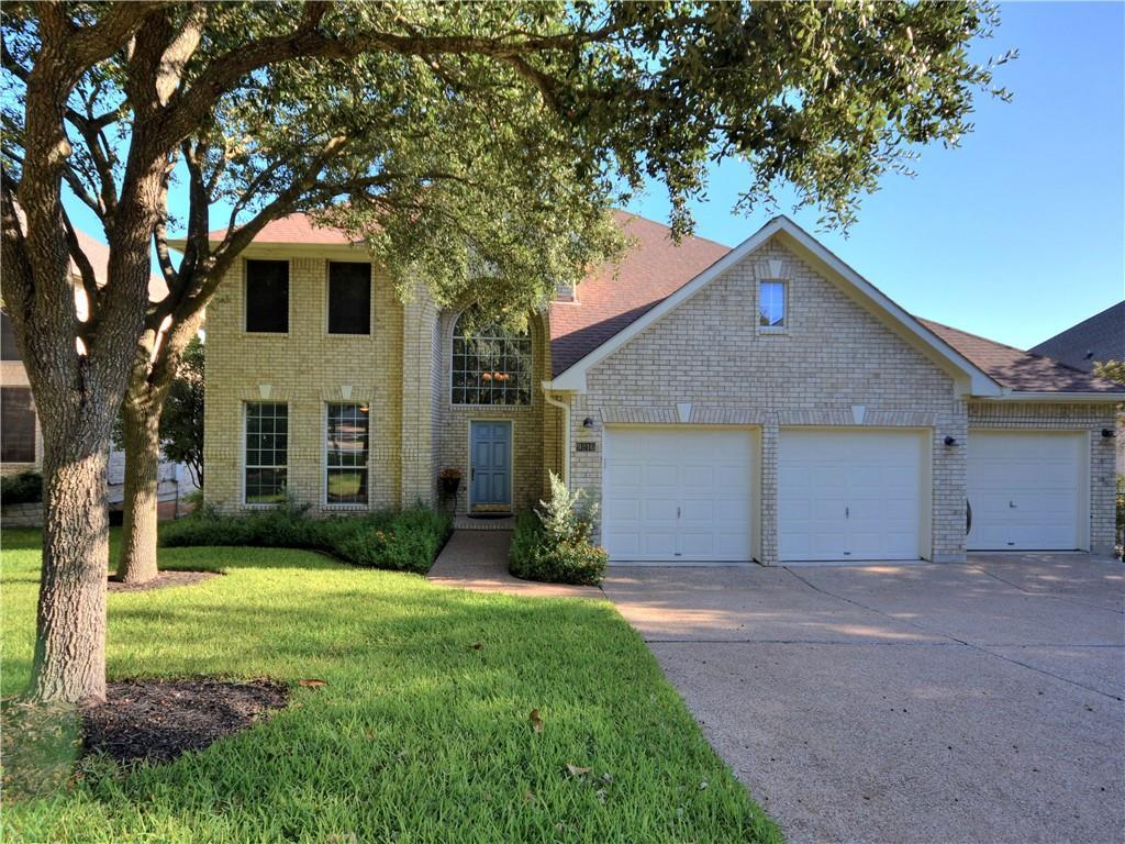 9216 Evening Primrose Path Austin, TX 78750 - Photo 2 of 31 a front view of a house with garden